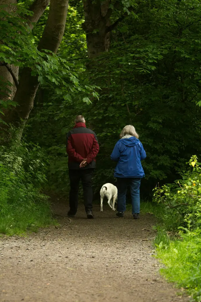 Retired couple on a stroll in their free time.